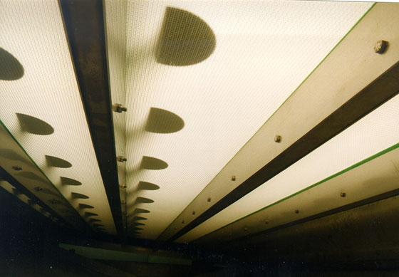 Transverse supports provide a slight downward pressure for improved water removal.